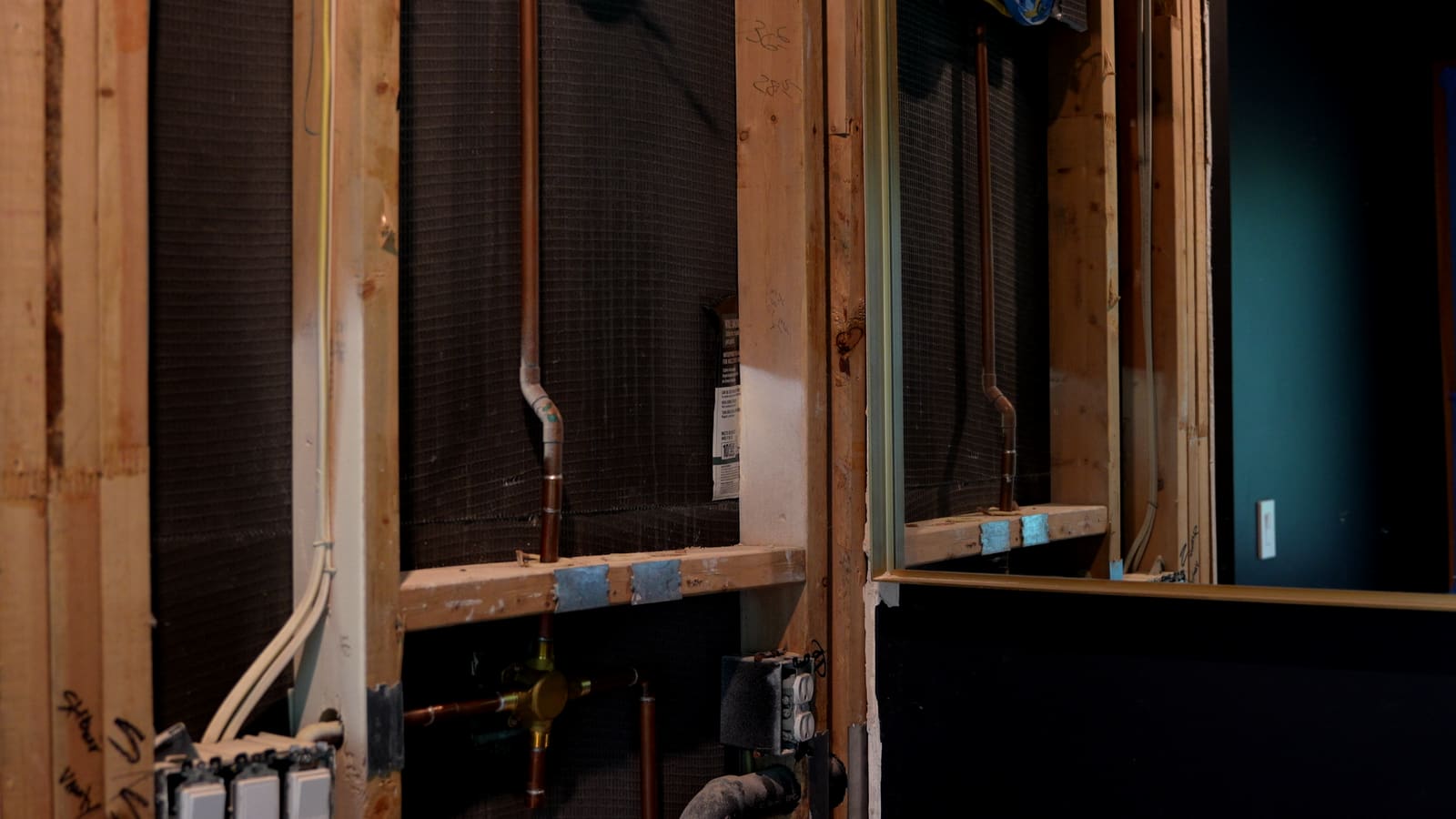 Interior walls opened up to the studs and pipes after the water intrusion